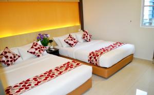 Postel nebo postele na pokoji v ubytování City Central Hotel