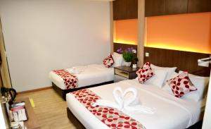 Postel nebo postele na pokoji v ubytování City Central Hotel