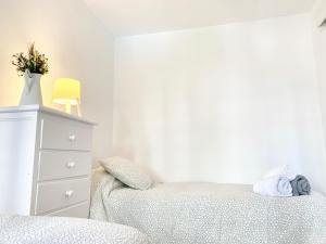 Posteľ alebo postele v izbe v ubytovaní Apartamento Góndolas