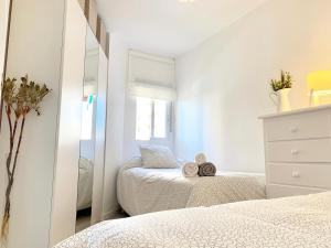 Posteľ alebo postele v izbe v ubytovaní Apartamento Góndolas
