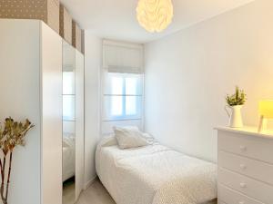Posteľ alebo postele v izbe v ubytovaní Apartamento Góndolas