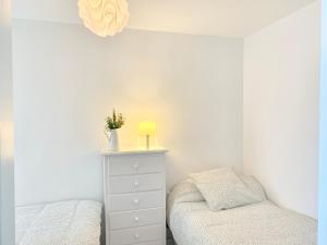 Posteľ alebo postele v izbe v ubytovaní Apartamento Góndolas