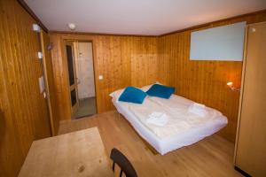 A bed or beds in a room at Hotel Hornerpub