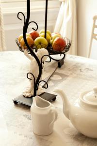 a basket of fruit sitting on top of a table at LA MONGEARDIERE in Ay +10 photos
