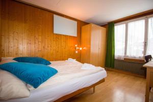 A bed or beds in a room at Hotel Hornerpub