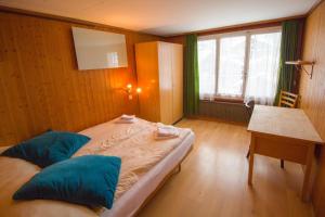 A bed or beds in a room at Hotel Hornerpub