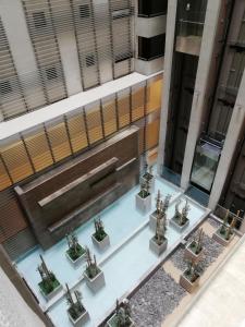 an overhead view of a building with a fountain at myLUXAPART Las Condes in Santiago