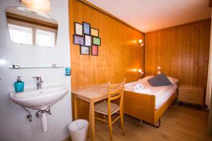 A bed or beds in a room at Hotel Hornerpub
