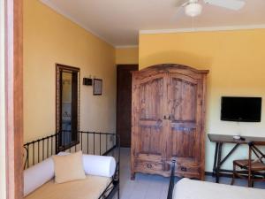 TV a/nebo společenská místnost v ubytování Hotel Il Caminetto