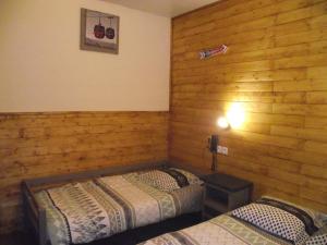 Postel nebo postele na pokoji v ubytování Hotel Valérie