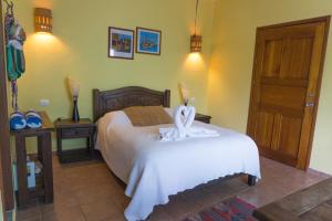 Postel nebo postele na pokoji v ubytování Sea Hawk Suites