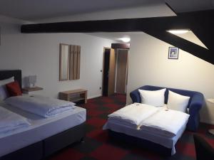 En eller flere senger på et rom på Hotel Luca