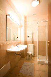 a bathroom with a sink and a shower at Hotel Villa Delle Rose in Oristano