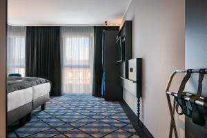 Voodi või voodid majutusasutuse Holiday Inn - the niu, Square Mannheim by IHG toas