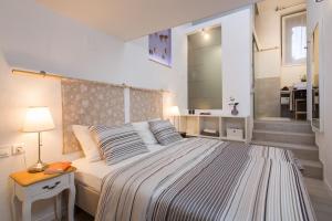 Postel nebo postele na pokoji v ubytování Rooms N&M
