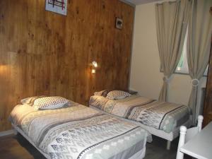 Postel nebo postele na pokoji v ubytování Hotel Valérie