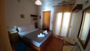 Ένα ή περισσότερα κρεβάτια σε δωμάτιο στο Villa Golden Ammos Sea View