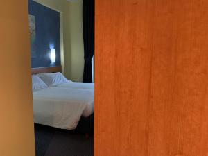 Uma cama ou camas num quarto em Best Western Hotel Class Lamezia