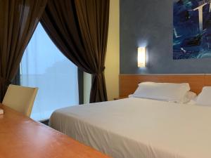 Uma cama ou camas num quarto em Best Western Hotel Class Lamezia