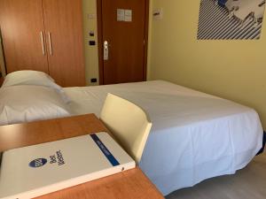 Uma cama ou camas num quarto em Best Western Hotel Class Lamezia