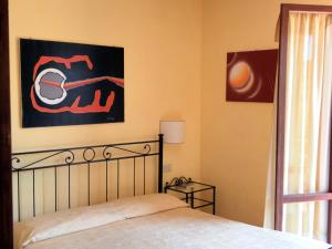 Postel nebo postele na pokoji v ubytování Hotel Il Caminetto