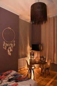 a bedroom with a table and a dining room at Vip room 209 in Trooz