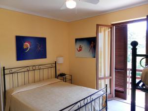Postel nebo postele na pokoji v ubytování Hotel Il Caminetto