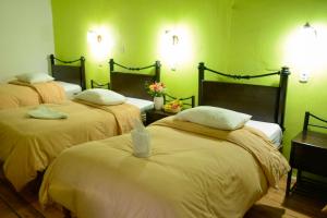 Кровать или кровати в номере Hostal Qorichaska