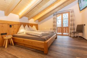 Katil atau katil-katil dalam bilik di Ferienhaus Neureiter