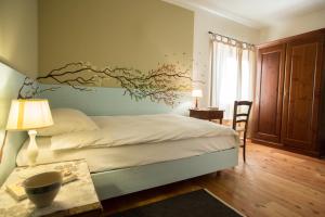 Postel nebo postele na pokoji v ubytování La Collina delle Mignole