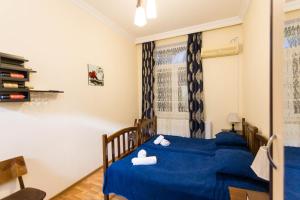 Łóżko lub łóżka w pokoju w obiekcie Gis Guest House