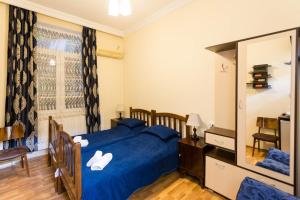 Łóżko lub łóżka w pokoju w obiekcie Gis Guest House