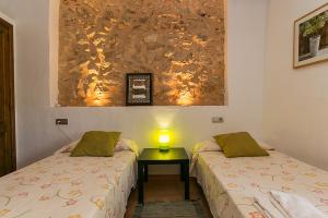 A bed or beds in a room at Country House Cadernera