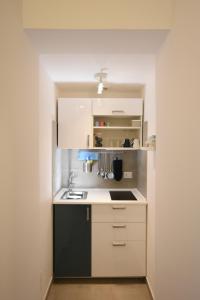 Virtuvė arba virtuvėlė apgyvendinimo įstaigoje a casa di Annita