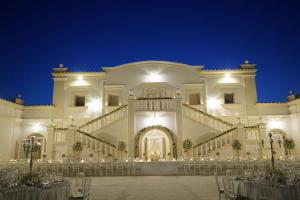 a wedding reception in a large building at night at La Magione in Foggia