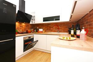 Kuchyňa alebo kuchynka v ubytovaní XY Suites - Design Apartments