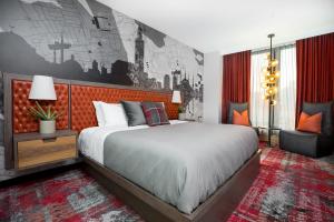 a bedroom with a large bed and a red wall at Bobby Hotel in Nashville +37 photos