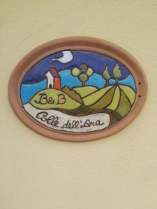a sign on a wall with a painting on it at Colle dell'Ara in Chieti