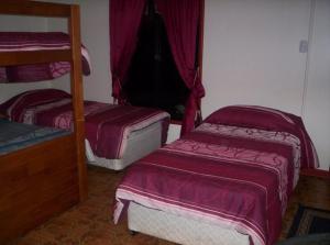 Cama o camas de una habitación en Cabañas Krava Inn