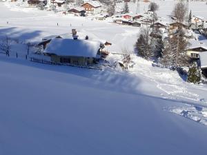 Ferienhaus Niedernsill v zimě
