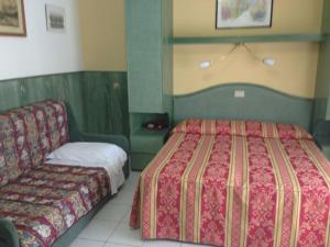 Postel nebo postele na pokoji v ubytování Hotel Harry's