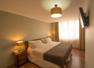 Katil atau katil-katil dalam bilik di Hotel Loreto