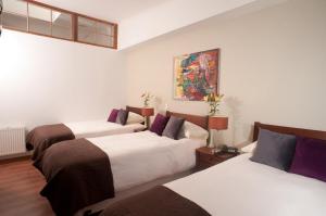 Katil atau katil-katil dalam bilik di Hotel Loreto