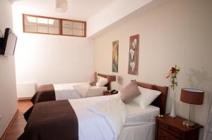 Katil atau katil-katil dalam bilik di Hotel Loreto