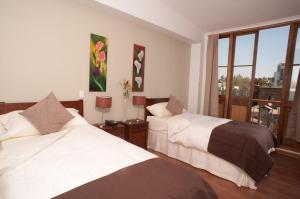 Katil atau katil-katil dalam bilik di Hotel Loreto