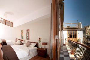 Postel nebo postele na pokoji v ubytování Hotel Loreto + 33 fotografií