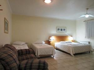 Een bed of bedden in een kamer bij Icaropê Hotel