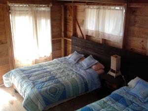 Postel nebo postele na pokoji v ubytování Reserva Azul