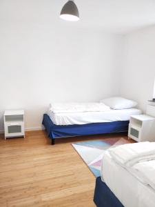 
Ein Bett oder Betten in einem Zimmer der Unterkunft AVI City Apartments MainHouse
