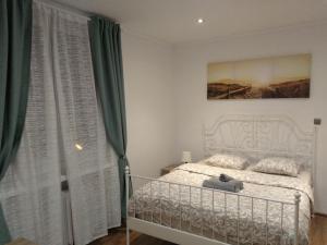 Posteľ alebo postele v izbe v ubytovaní Modern&Cozy Rooms